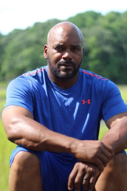 Lucius Alston outdoors in blue training clothes