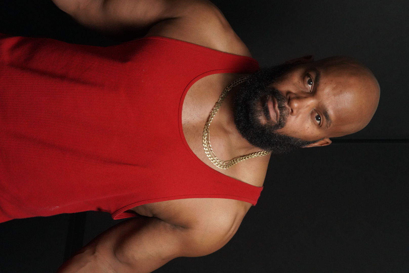 Lucius Alston in a red training tank
